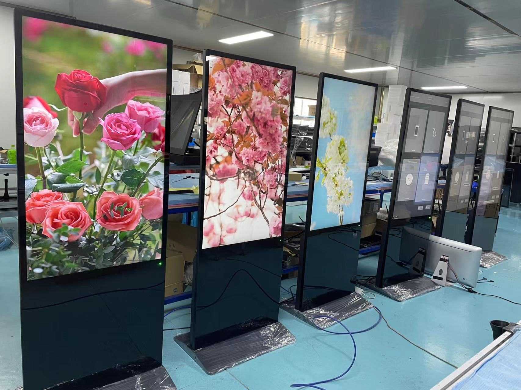 65 -calowy gracz reklamy stojącej na podłodze
